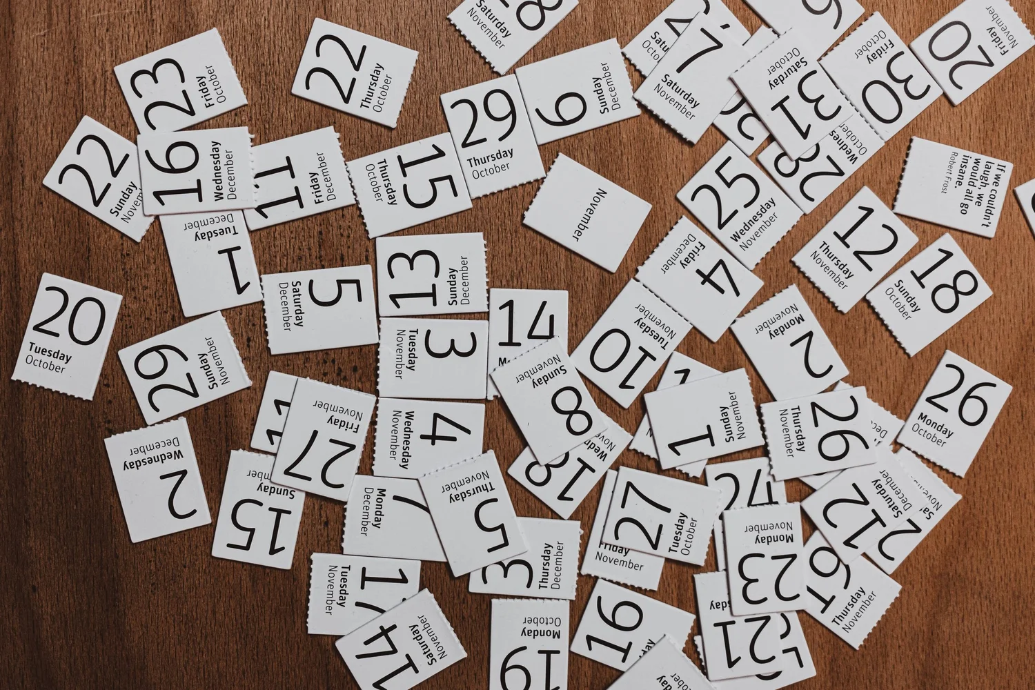 Calendar date cards scattered across a table